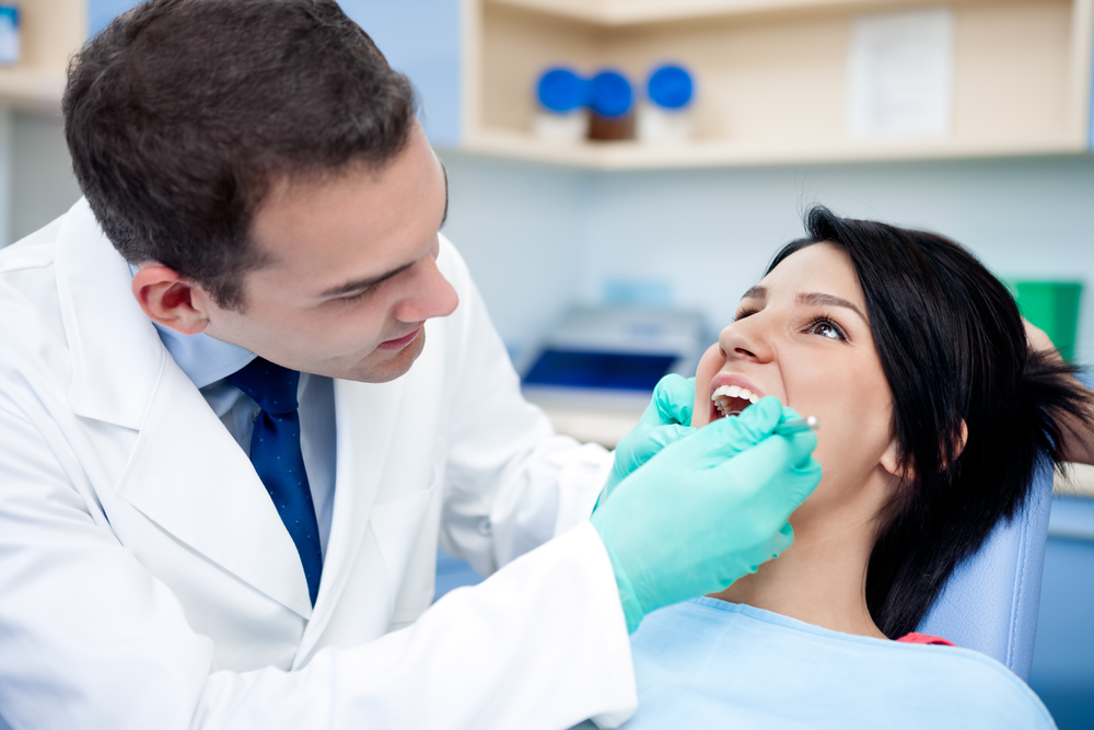 Trustworthy Greenville dentist providing dental treatment.